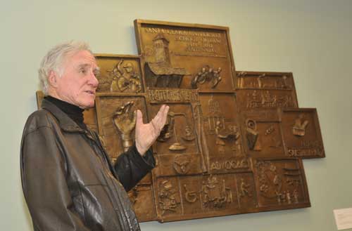 Jerry Smith with the sculpture he created for Santa Clara Law's centennial in 2011.