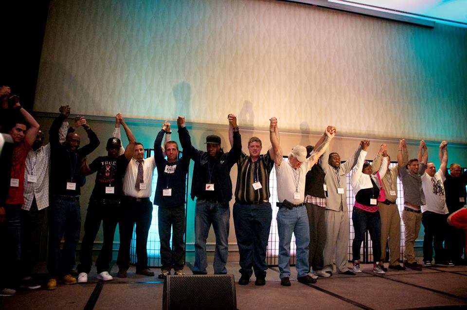 Exonerees celebrate on stage at the 2016 Innocence Network Conference. Photo: Innocence Network.