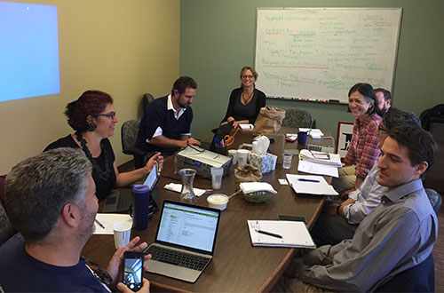 Members of the California hair microscopy coalition meet at the NCIP office. Photo: Audrey Redmond.