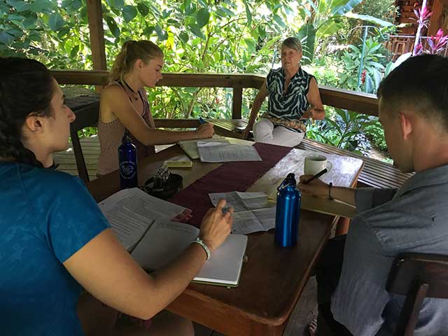 Clinic students Susan Shapiro, Chloe Thomlinson and Kyle Heitmann interviewing a local business owner in Belize