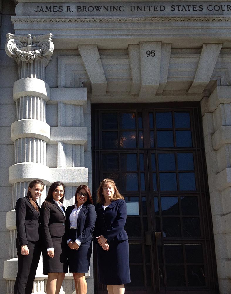 Tess Mullin ’15, Anita Koumriqian ’15, and Karla de la Torre ‘14 with Professor Abriel in front of the Ninth Circuit Court of Appeals in San Francisco.