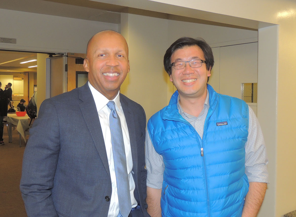 Bryan Stevenson poses with Santa Clara Law 1L student  Jonathan Choi,  after the Q & A event
