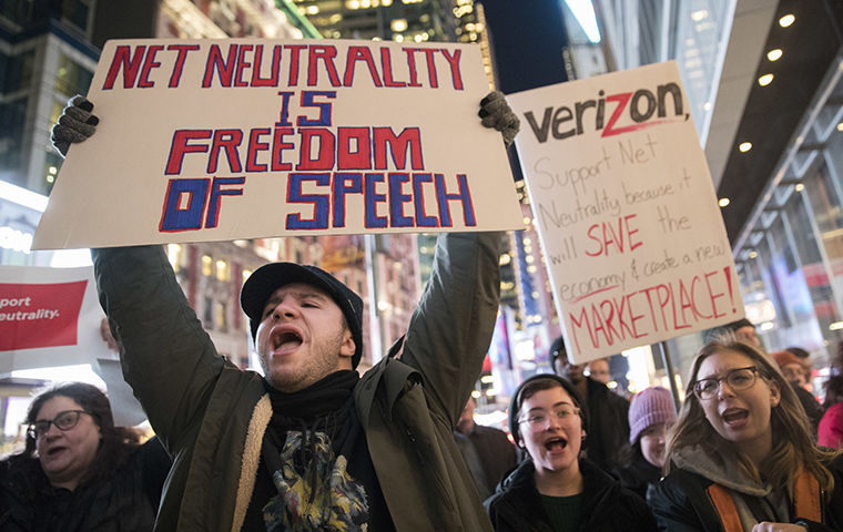 Demonstrators rally in support of net neutrality outside a Verizon store, Thursday, Dec. 7, 2017, in New York. AP Photo/Mary Altaffer