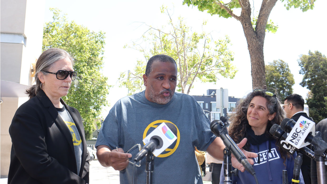 Joaquin Ciria speaking to press after his exoneration, with Linda Starr and Paige Kaneb