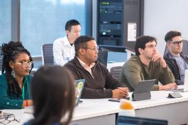 students sit in lecture hall