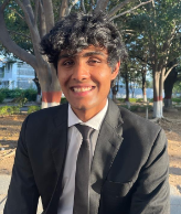 Headshot of student in a suit.
