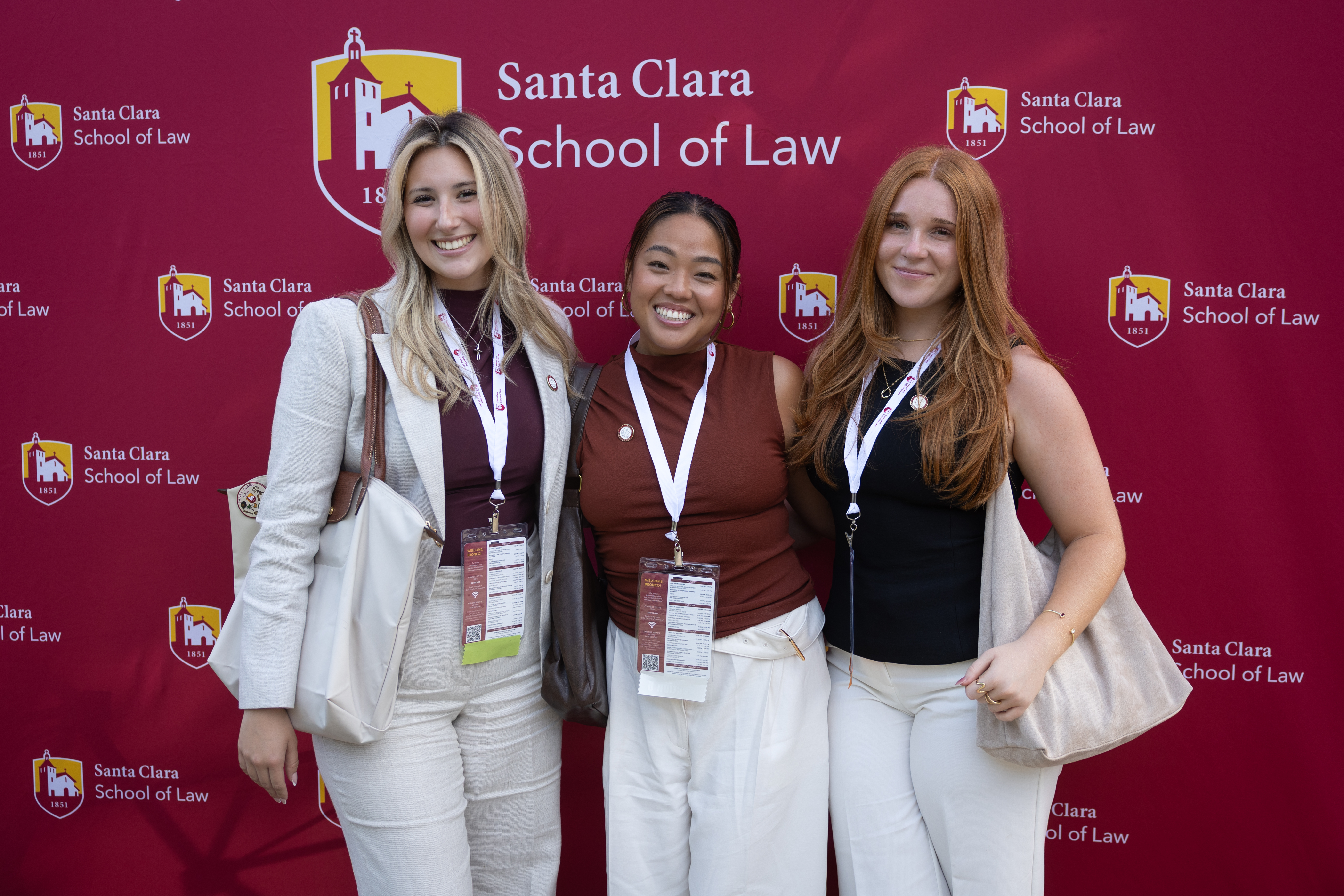 Three students smiling 