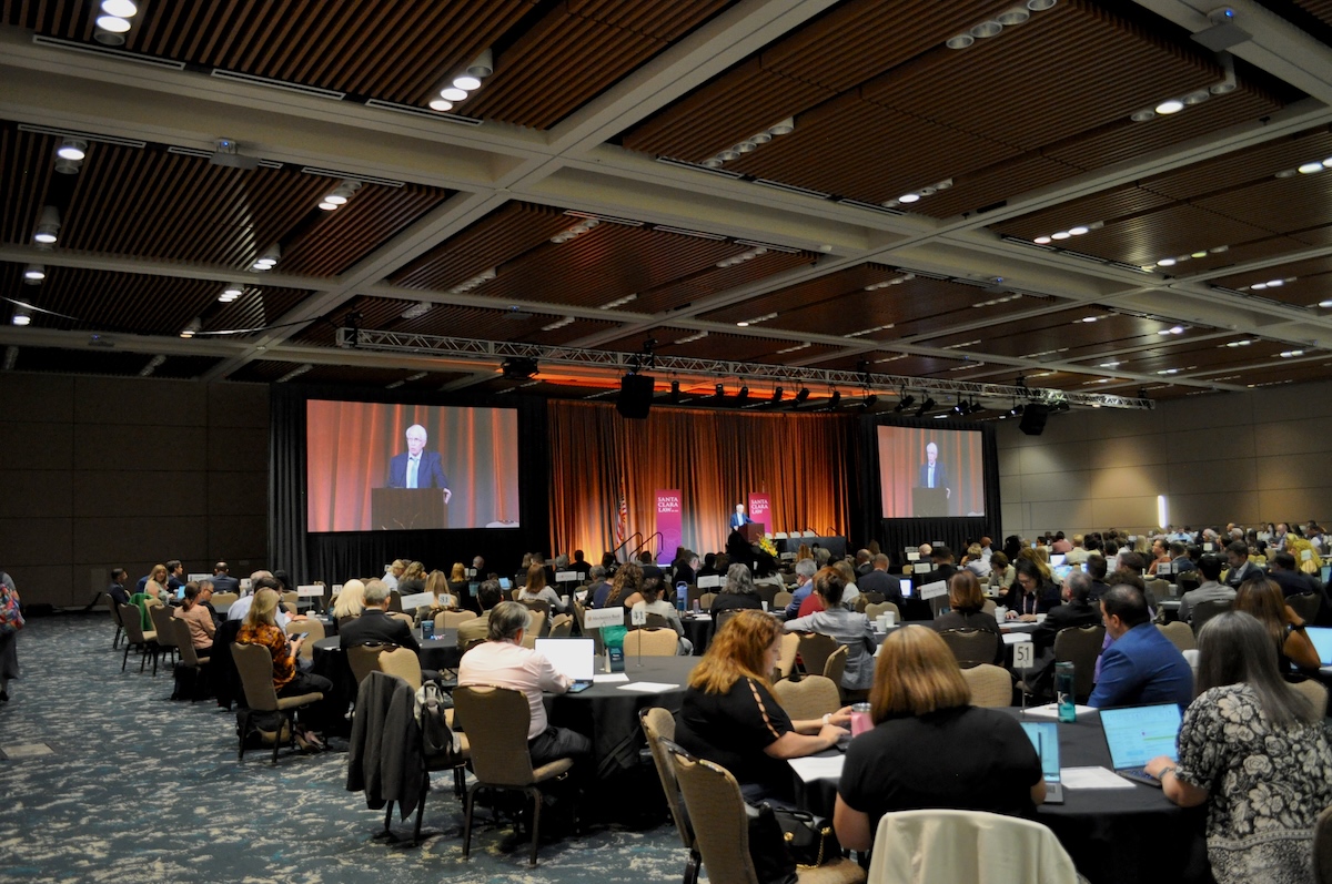 a presenter at the Kasner symposium speaking in front of hundreds of people