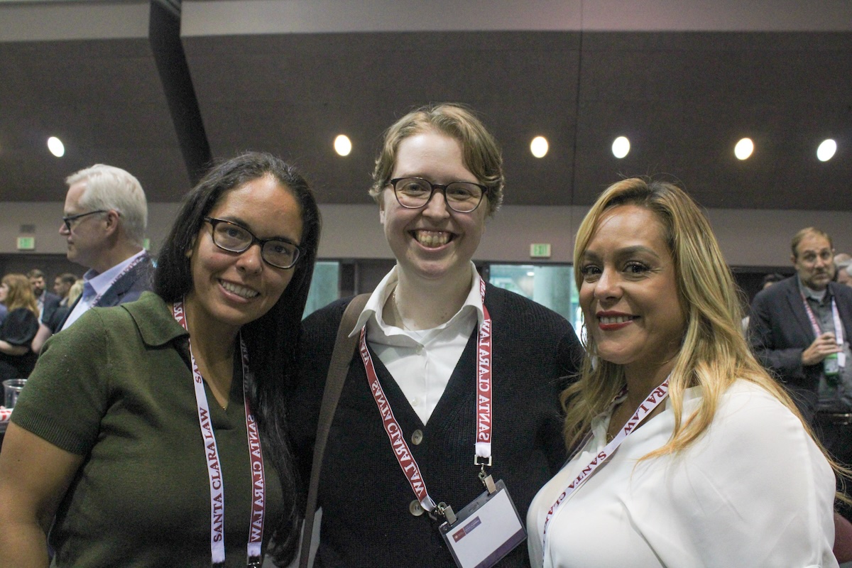three smiling guests at Kasner Symposium