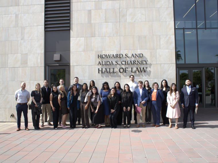 a photo of a large group of students in front of charney hall santa claras law school building 