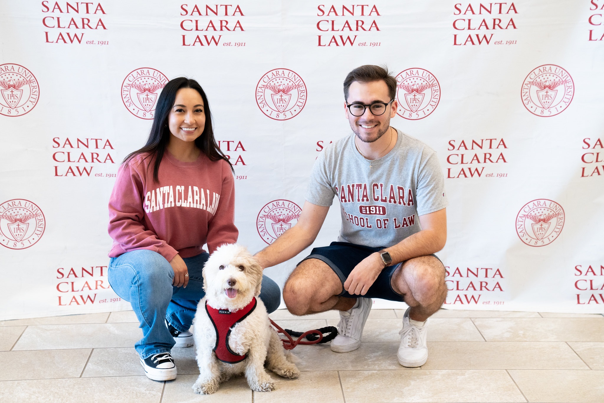 Students Petting and Posing with a Dog
