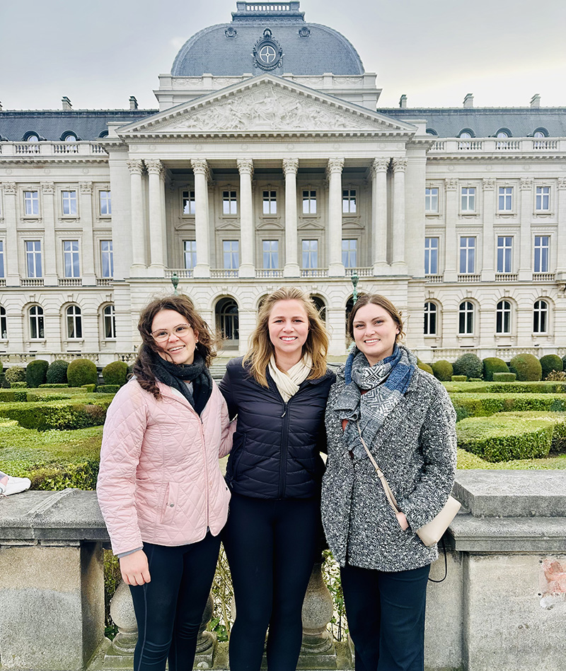 Lexie Legaspi (3L), Kyra Soares (3L), and Alisha Hacker (3L) at the Royal Palace of Brussels in Belgium.