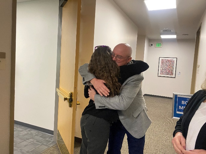NCIP Supervising Attorney Paige Kaneb and NCIP Client Darwin Crabtree embrace after the March 16 CalVCB hearing in Sacramento.