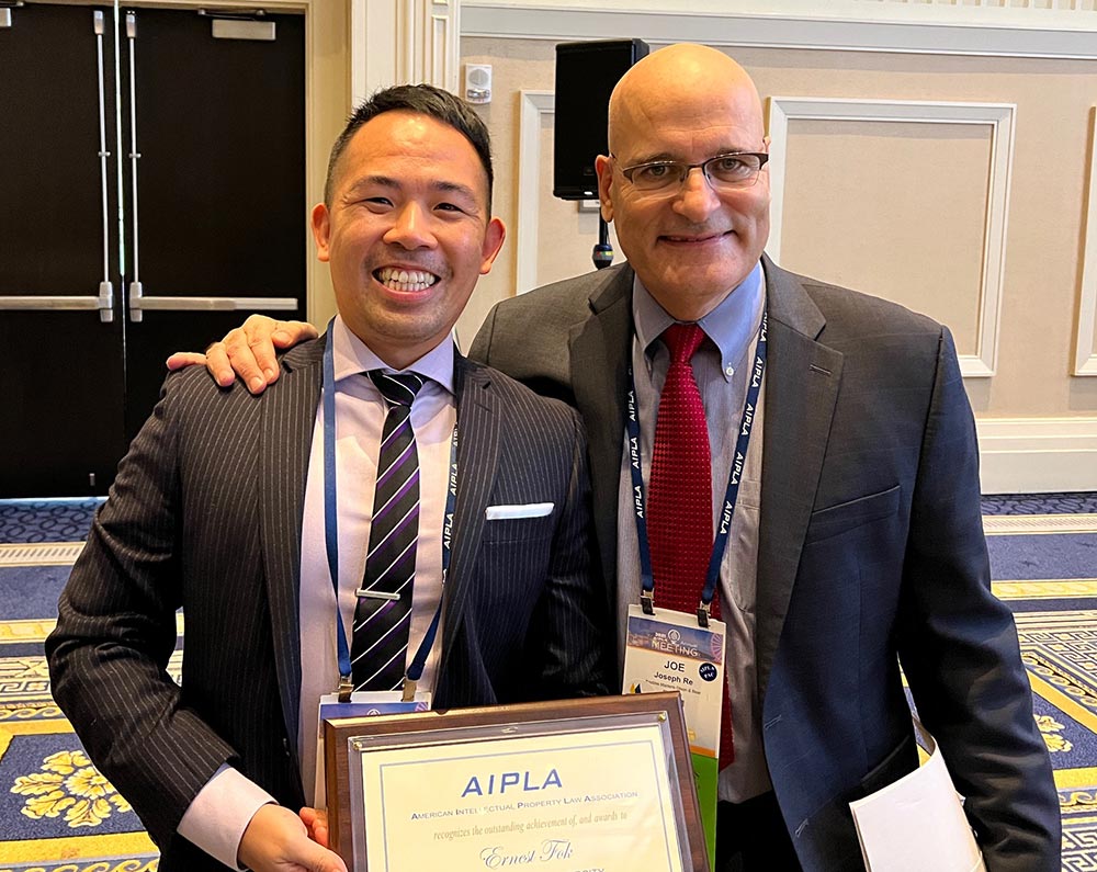 Ernie Fok JD '21 with Joe Re, President of the American Intellectual Property Law Association
