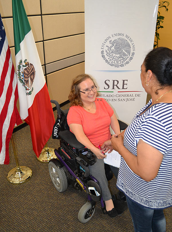Third-year law student Catherine Connor greets a client at the Mexican Consulate.