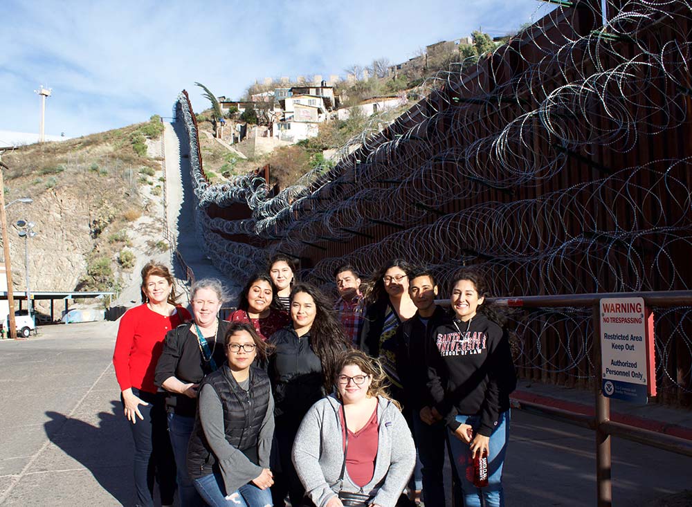 Santa Clara Law students at the border wall in Nogales